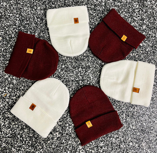 Circle of white and maroon beanies