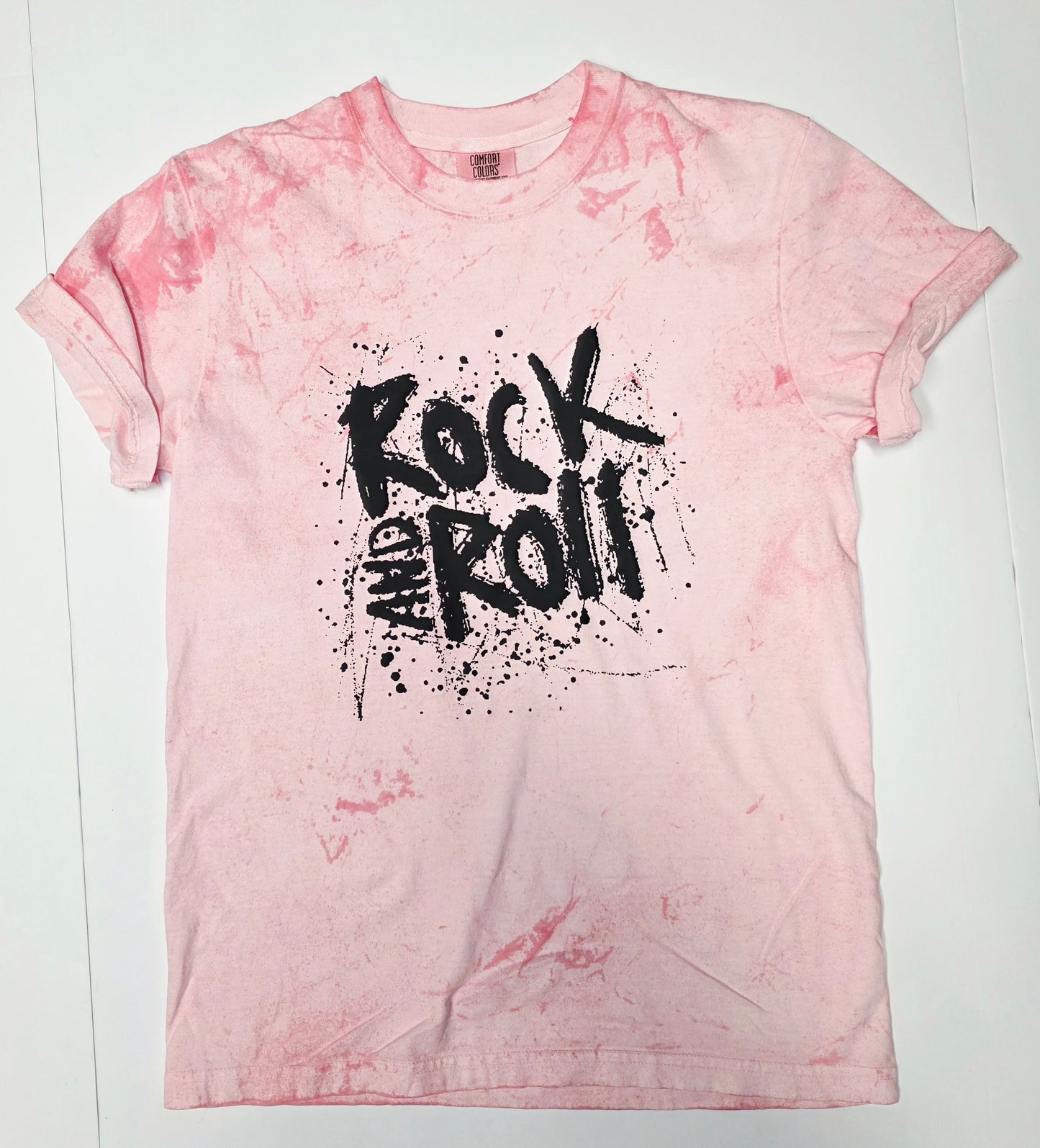 flat lay pink rock and roll tee