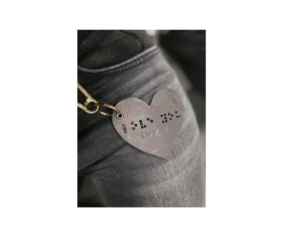 black leather heart with rhinestone "love you" in Braille